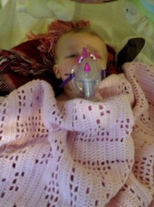 At home with me. Look at the cute dragon mask for her nebs :)